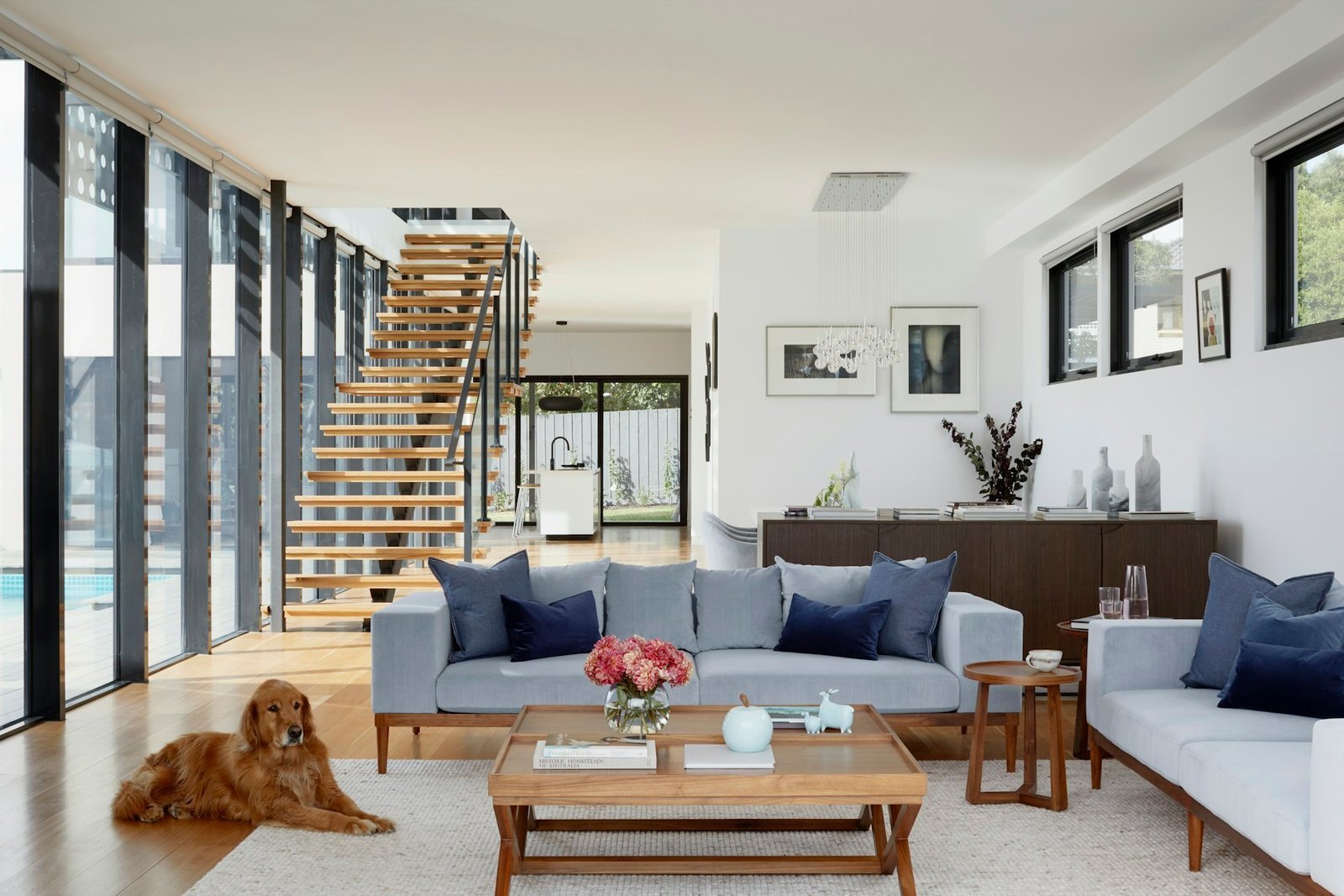 Illustrative open-plan living room and floating timber staircase